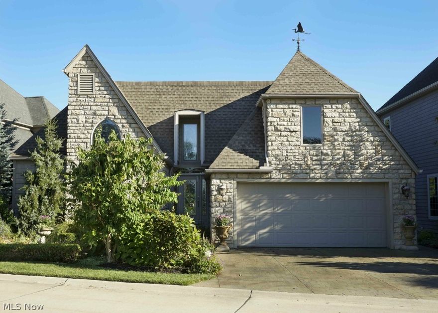 Living the Dream!!  It's like you're on vacation 365 days a year!  Incredible lake views from all 3 levels, soaring ceilings and a wall of windows to enjoy the scenery.  Unique architecture in this contemporary, open concept home.  3 full levels with a walk-out to stamped patio and dock to park 2 boats. Master suite has trayed ceiling with a two-story vaulted bath with beautiful stained glass window.  Prepare your meals while looking out at the water from your Amish built custom kitchen with beech cabinetry and granite countertops. Stainless steel appliances and touch faucet.  Beech flooring throughout.  2-story stone fireplace and remote to tilt tv for just the right light. 3-M covering on windows. Read or enjoy video games in the 2nd story loft and gaze at the tranquility of the East Reservoir. There is also a bedroom on level 2.  Onto the downstairs.  This could be an in-law suite, as it has its own entrance. A large family room lined with windows, a bedroom tucked away behind stain