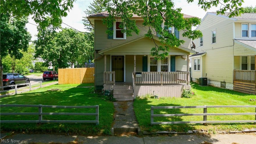 1203 Beardsley St Akron OH 44301 is a beautiful corner lot with a large backyard, and side yard with 2022 tall privacy fence, 2 car detached garage and ample space for parking. Home has great space with 4 bedrooms, 2 full bathrooms & 2 separate living spaces with a Living Room & separate Family Room. There are 3 bedrooms upstairs all good sized with one even including vanity desk space. 2nd floor has large full bathroom with tub & shower combination with plenty of natural light. Additional 1 bedroom on the main first floor with walk-in closet & full bath at its entry door & includes a shower. The main level has a front living room that encompasses the entire front of the home & a great size family room in the back of the home with a sliding glass door leading to the fenced in yard with a gate to the driveway as well as side entry into the garage swing door. The inviting front porch just asks for a swing  & something cold to drink & enjoy a relaxing summer day. There's plenty of yard fo