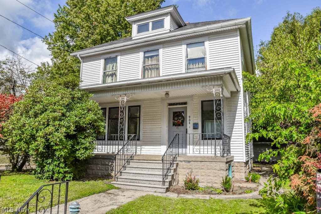 Charming 4 bedroom, 1.5 bath colonial with a 2-car detached garage! Tall ceilings throughout this home! A beautiful foyer greets you with gorgeous woodwork and a built-in bench with storage. Pillars with glass inserts separate the foyer from the bright and cheery living room. It opens to the dining room featuring 2 large windows and built-in seating with storage. Crack open your cookbook in the applianced kitchen with bar seating, a pantry and lazy Susan. Convenient half bath on the main level. Upstairs, there are 4 bedrooms and a full bath with shiplap walls, an updated vanity and vessel sink. Possible extra living space with a partially finished rec room on the lower level with a wood burning stove and wet bar. Nice curb appeal with a covered front porch. Come see all this home has to offer!