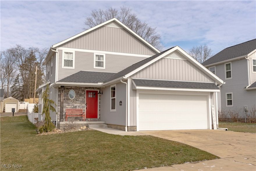 Picture-perfect and move-in ready! This stunning 2020 Regal Homes build seamlessly blends modern elegance with cozy charm, featuring shiplap accents, industrial touches, and custom window treatments throughout. With over 2,800 sq ft, this 3-bedroom, 2 full-bath, 2 half-bath home offers an inviting open-concept layout designed for both comfort and style. Step inside to a welcoming foyer, complete with a window seat and mudroom with built-in coat/bench, setting the stage for the thoughtfully designed spaces ahead. The gourmet eat-in kitchen is a chef’s dream, boasting stainless steel Whirlpool appliances, a large center island, granite countertops, a coffee bar, soft-close cabinets, and a walk-in pantry. Flowing effortlessly from the kitchen, the showstopping living room features vaulted ceilings, an electric fireplace, and direct access to the private, fenced-in backyard with concrete patio and pergola—perfect for relaxing or entertaining. The first-floor primary suite is a true retreat, offering a spacious layout, double vanity, and a walk-in glass shower, with a walk-through closet leading directly to the laundry room for ultimate convenience. Upstairs, you’ll find two generously sized bedrooms, a full bath, and a large loft area—ideal for a sunlit office or additional living space. The beautifully finished lower level expands the home’s versatility, featuring a recreation area, a half bath, and newly added built-in storage shelves. Recent upgrades include fresh interior paint throughout, a new pergola, and a vinyl-fenced backyard with new landscaping, grading, and overseeding. The front yard has also been leveled and overseeded for enhanced curb appeal. Plus, enjoy the charming addition of a FREE Little Library for community sharing. Located within Jackson LSD, just a short walk to Lake O' Springs and minutes from shopping, dining, and highways, this home offers the perfect blend of modern convenience and timeless charm. Don’t miss out—schedule your showing today!