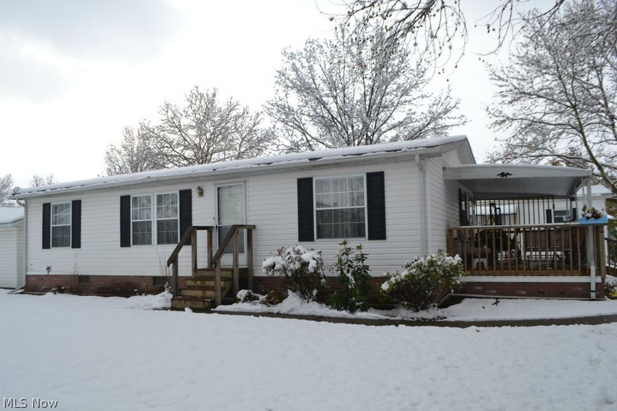 Navarre Village 55+ Adult Community!  2 Bedrooms plus Den!  26 x 42 1994 Skyline Double Wide Mobile Home.  Large Eat-In Kitchen with Vaulted Ceiling, Skylight and Window over Sink.  Master Suite with Large Closet, and Attached Bathroom with Safe Step Walk-In Tub.  Den is adjacent to Living Room and Could be Used for TV Room, Library, Office or Craft Room.  Newer Carpet in Living Areas.  Vaulted Ceiling in Kitchen and Living Room.   Handy 1st Floor Laundry Room with Washer, Dryer and Utility Tub.  12 x 20 Front Porch.  1 Car Carport.  Storage Shed.  Nice Floor Plan!  Clean and Neat as a Pin!