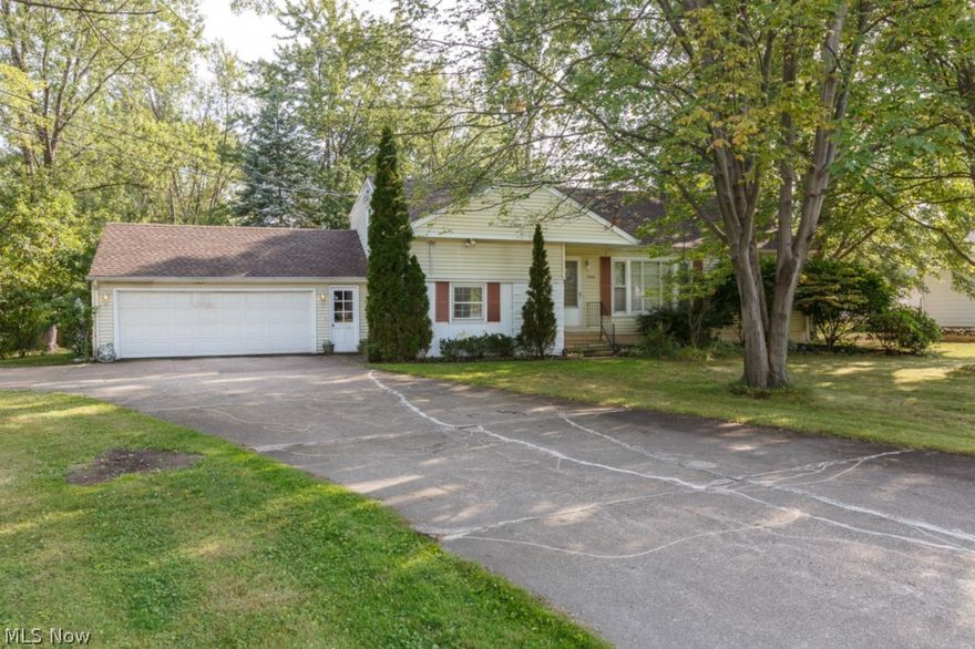 Just under 2000 square feet with huge yard. Garage is 26x26 - will fit three cars and lots of extra parking. Large family room with vaulted ceilings and skylights. New roof 2009, Some new windows, A/C 2009, tractor, lawn sweeper stay.