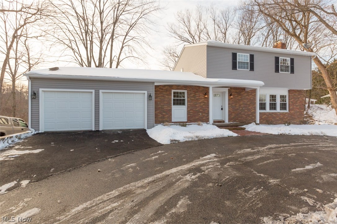 Spectacular Colonial on nearly 1/2 acre lot and shows like a model home! This 4 bedroom with possible 5th bedroom and 2 1/2 baths is loaded with updates throughout. Updates include the following that were just completed January 2016: windows, deck, furnace, ac, roof, kitchen, baths, all stainless appliances, stone wall fireplace with gas logs, lights, hot water tank, electrical panel, siding, paint, carpet and more. Golf course views of Madison Country Club's 14th hole. This home also features walk out basement. Beautiful hardwood floors on the 2nd level. Office on the first floor which can be 5th bedroom. Eat-in kitchen, dining room, living room, family room. 2 car attached garage. 2 large storage rooms in the basement. Move in ready!!