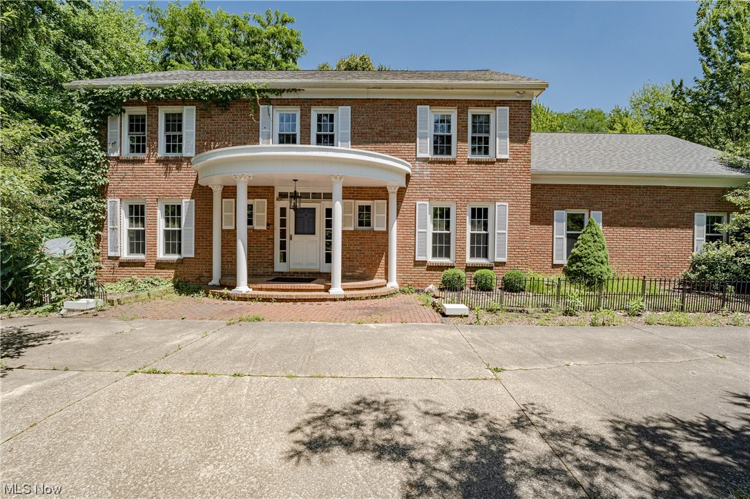 Situated on 5 wooded acres at the end of a quiet cul-de-sac, this spectacular property provides a unique opportunity to transform a lovely home and tranquil yard into your perfect countryside retreat! The spacious brick home features over 4800 square feet of living space with 6 bedrooms, 3 full baths, 3 half baths, a 3-car garage with naturestone flooring, and more! It just needs your creative vision and personal touches! A welcoming foyer greets you at the front of the home, with the living room and formal dining to your left. The dining room is open to a lovely sunroom with a spiral staircase that ascends to a lengthy bonus room at the back of the house. The eat-in kitchen features gleaming hardwood floors and a distinctive coffered ceiling that continues into a cozy family room. Here you will find a wood stove and french doors that open to an enclosed porch. There is a 2-room office off of the foyer as well as a half bath.A second half bath and a laundry room complete the first floo