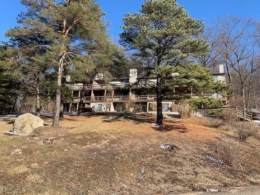 Beautiful End Unit Condominium in Atwood Ridge at Atwood Lake. Gorgeous views from the 2 level spacious decks accessed from living and dining room and both bedrooms. The lower level features 2 large bedrooms, a full bath and foyer. The upper floor features an open floor plan with vaulted ceilings, living room, dining area and spacious kitchen. Includes all appliances, washer and dryer. Recent updates include brand new bathroom with tiled shower, new flooring throughout, newer lighting and fresh paint. Many recent improvements to the complex - all new decks, concrete walkways and patios. 1540-acre Atwood Lake has a beautiful beach, walking trails and tons of water sports. Conveniently located close to the Yacht Club and both Marinas for dining, entertainment and boating.