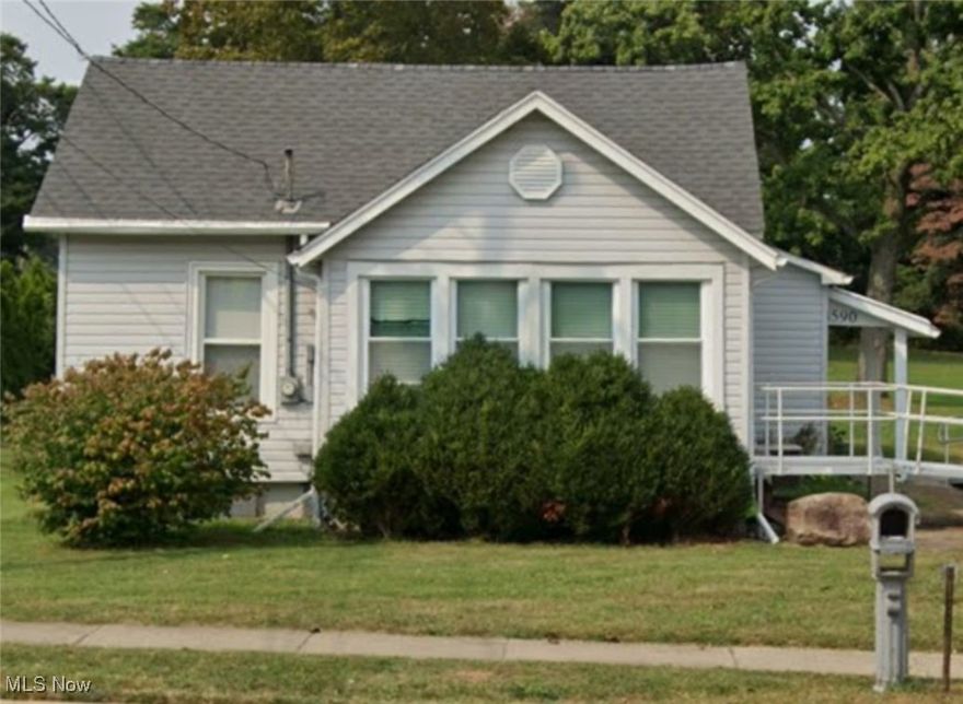 Great things come in small packages! This adorable cottage style house on just under 1/2 acre has been waiting for you to turn it into a home again. Priced to sell, this home is loaded with surprises such as a large mudroom entry way off the side of the home which is a handy extra room for laundry and storage for all of your extra outdoor gear. The home features a large, eat-in kitchen with enough space to host gatherings and still have plenty of elbow room for meal prep. A conveniently located family room is the perfect place to cheer on your favorite team while staying in close proximity to the snacks in the kitchen. A covered front porch acts as a three season room and can be used as extra living space or a cozy enclave for your morning coffee or a hideaway with your evening cocktail. Two decently sized bedrooms and a full bath round out the living space. A Lorax camera system is included in the sale of the home.