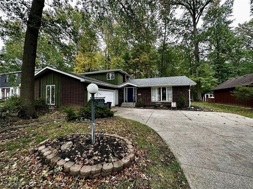 Welcome to this spacious two-story residence set on a generous lot with mature trees and a welcoming approach. Inside, the home offers a bright and comfortable layout with multiple living areas that create an easy flow for everyday living or gatherings. The living room and family room are both filled with natural light, with the family room featuring a fireplace that adds warmth and character. An eat-in kitchen provides plenty of room for casual meals, while a separate dining area offers flexibility for more formal occasions.

With four bedrooms and two full baths plus an additional half bath, the layout offers versatility across both levels. Bedrooms are well-sized, several with hardwood flooring, and the primary suite includes its own private bath. A convenient first-floor laundry room adds everyday functionality, and the partial unfinished basement offers additional storage or future potential. Outside, the backyard provides space to relax, garden, or entertain, complemented by an attached two-car garage and paved driveway. This home presents a solid opportunity for buyers looking to personalize and add value while enjoying a comfortable footprint in an established neighborhood.