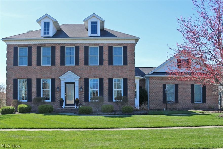 Stately colonial with modern flare.  This spacious home has 5 bedrooms, 3.5 baths, wonderful kitchen with granite counter tops and updated appliances, butler's pantry flanking the spacious formal dining room, 1st floor laundry room with large closet, 1st floor living room plus great family room with fireplace and wall of windows/doors overlooking the beautiful back yard.  Up stairs you will find 4 spacious bedrooms, 2 full baths and great closet space.  The walk-out lower level has family room, 5th bedroom, full bath and large work out room.  The large back yard has extensive paver patio and wonderful landscaping. There is a partially finished (drywalled) bonus room above the garage with separate stairs.  Furnace/AC updated in 2014.  This home is in top notch condition.