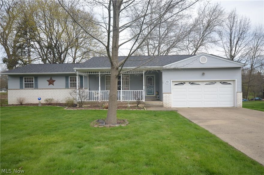 Tallmadge ranch in a highly desired location w 1st floor laundry. Brand new roof (2019) and updated furnace and AC! Large deck out back plus a sun room to relax and enjoy a private view. Enter through the covered front porch to a large living rm with big picture window. The dining area includes a chair rail and has access to the sun room as well as the eat in kitchen w raised panel oak cabinets and solid surface counter. The pantry has been converted for an option as a 1st floor laundry for stackable units. The kitchen is open to the family room with brick fireplace and built in shelving/cabinets. The bedrooms are very spacious and the hallway full bath had a "tub cut" to allow for a step in shower. The master bedroom has a private full bath w tile shower. Full basement with walkout access and tons of space!