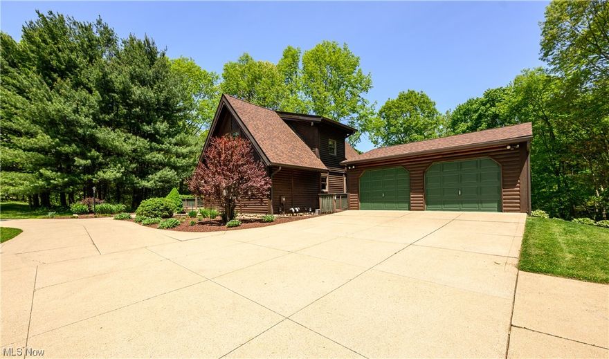 Wow! Check out the one of a kind log cabin located in the Northwest LSD! This 4 bedroom, 2.5 bath home was custom built in 1989 and has been very well maintained and updated over the years. Situated on over 4 acres of scenic beauty filled with open grass as well as, plenty of trees and wildlife the location could NOT be better. If that isn't enough, you are in very close proximity to major highways, shopping and restaurants! Make your way up to this stunning log cabin and prepare to be amazed. First, you come to the main living room featuring vaulted ceiling with all natural wood beams, a floor to ceiling brick fireplace and a ton of windows allowing so much natural light. This room is a show stopper! Not only that, is has a sliding glass door that leads out to your tiered deck which overlooks your private backyard. It is the perfect place to enjoy these beautiful Summer days and nights and all of the scenery and wildlife it has to offer. Just through the living room is the eat-in kitc