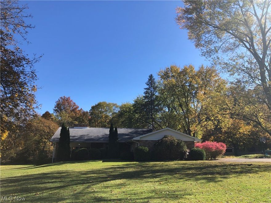 Exceptional 5 Bedroom Canfield Home in a Prime Location with an Extra Lot on a dead end with a park like setting in the backyard (.96 Acre). If you are looking for Space and Privacy this is the One! You'll be greeted by a Grand Foyer that leads to a Formal Living Room with a Fireplace.  The Extra Large Family Room has built in seating along the spacious windows that overlook the backyard, a fireplace, and access to the covered back porch. The Kitchen and Dining Room can fit a crowd for all your holiday entertaining. There is also a half bath and laundry/utility room on this level. Upstairs has a massive master bedroom with a master bathroom, 4 more large bedrooms with wood floors under the carpet, and another full bathroom with double sinks. There are large closets and plenty of storage throughout. The basement has nature stone flooring , has been freshly painted and also has laundry and a shower. This would be a great house to raise a family or for multi generation living ,  all this and in Canfield Schools with a convenient location to shopping , restaurants, schools, library and easy walkability. Call today to make this your new dream home!