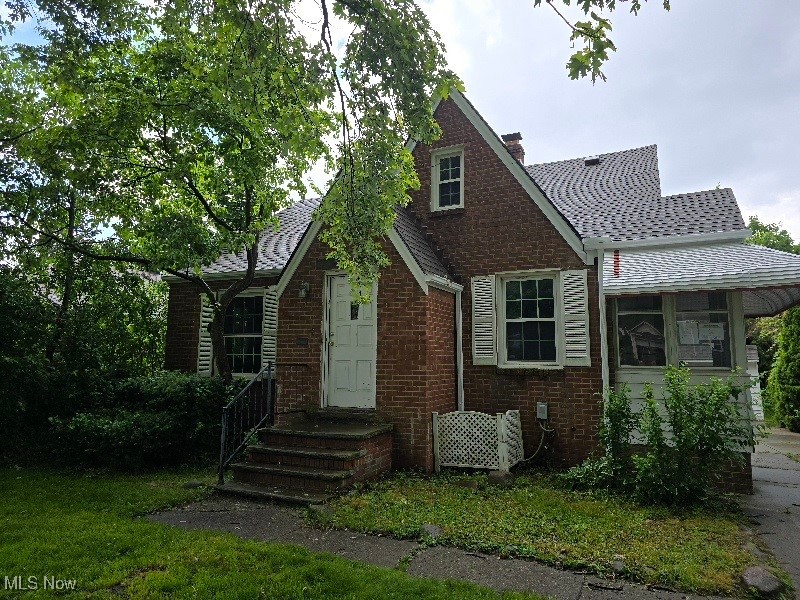 This classic brick Cape Cod has so much to offer! Featuring 3 bedrooms—including two on the main level and a spacious master suite upstairs—and 2 full bathrooms, this home combines charm with functional living. You'll love the eat-in kitchen that opens to a bright side sun porch, perfect for morning coffee The first-floor family room is a standout, boasting a vaulted, beamed ceiling and a cozy fireplace—ideal for relaxing or entertaining. Hardwood floors run throughout the main living areas, adding warmth and timeless appeal. The lower level includes a large recreation room and an additional full bath, offering great bonus space for hobbies, guests, or a home office Additional features include a 2-car garage and a large living room perfect for gatherings. Home is being sold as-is, offering a great opportunity to personalize and make it your own.