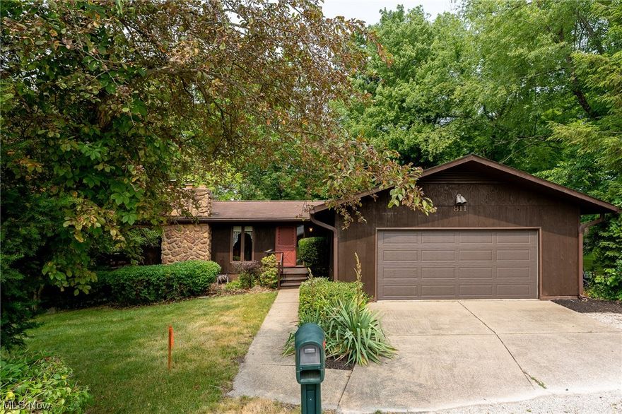 Welcome home to this one-of-a-kind 3 bedroom/2 bathroom ranch on over a half an acre of trees and privacy in North Canton school district!  Walk through the front door into the oversized foyer with ceramic tile floor and extra large coat closet.  The foyer opens directly into the great room and dining room areas. 
 Great room is cozy with updated LVP flooring and fireplace with beautiful stone surround.  Updated LVP flooring continues into the dining area with the first of two balconies through sliding glass doors.  The kitchen boasts beautiful cherry cabinets, ceramic tile floor, walk-in pantry.  The dinette area in the kitchen leads to the second balcony that is large and perfect for grilling and entertaining.  First floor laundry is right off the garage and perfect for all of your mudroom and storage needs.  Primary bedroom has an en suite with garden jetted tub and 7x8 walk-in closet.  Two additional bedrooms and full bathroom with shower/tub combo finish off the main level.  Head