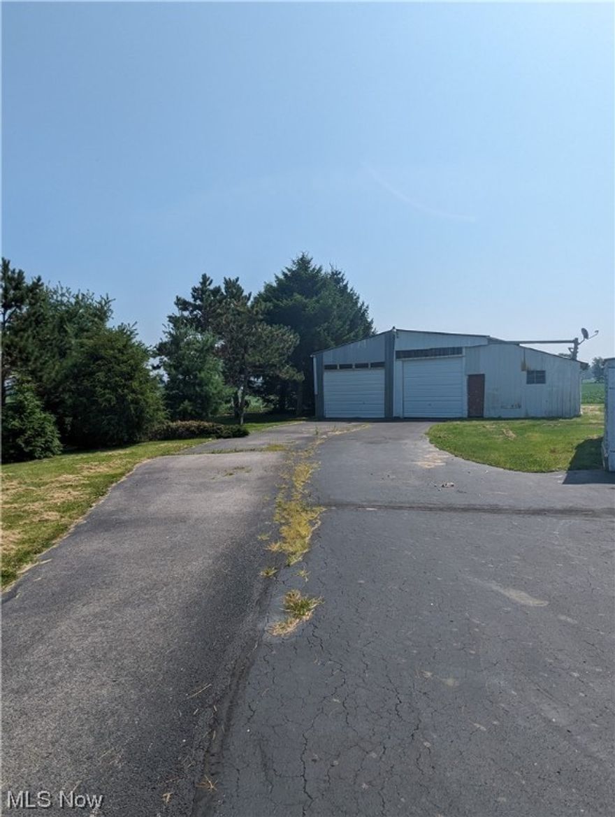 2+ Country acres to call home! Mostly cleared yet surrounded by mature trees for privacy. Huge paved driveway leads to a pole barn. This is an ideal spot to build your barndominium!