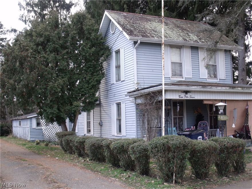Covered porch, enclosed breezeway, plenty of storage. 3 lots, 2 back lots are fully fenced. Carport. Great investment property. Front room has wood floors and access to upstairs bedroom, also with wood floors. Dining area has wood-burning stove and access to main floor bedroom. Full bath and kitchen at rear of home. Property consists of 3 lots on 2 parcels. Need 24hrs notice to show for tenants.