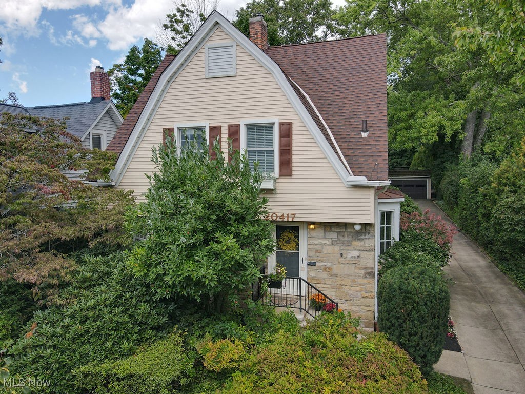 Welcome to this exciting and meticulously maintained colonial near the Van Aken District of Shaker! The enchanting curb appeal is a sample of the charm found inside. The light filled living room has a bay window, newer LVT flooring and a decorative fireplace. The spacious dining area has another bay window, engineered hardwood flooring and adjoins the well equipped kitchen with ceiling height cabinetry, custom pantry built around the newer refrigerator, casual breakfast bar and stainless steel appliances including a four burner gas range! Unlike most homes, the extraordinary family room has two walls of windows overlooking the private yard with lush lawn, gardens and gazebo! Custom pine paneling, built in shelving and an electric fireplace makes this the special cozy room for relaxation and casual gatherings. Upstairs, the primary bedroom has recently refinished hardwood flooring and walk-in closet. The primary bathroom has a dual vanity, step in shower and newer LVT flooring! Three additional bedrooms have newer carpeting, generous closet space and share the hall bathroom. The lower level is the ideal space for exercise or hobbies and the fenced yard and gazebo.is the perfect retreat to enjoy nature. There are two A/C units and a new hot water tank. Nothing left to do but move right in and enjoy this charming home!