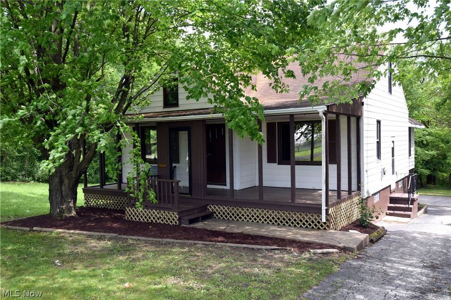 This 1950s built home is nestled right in the heart of Youngstown near historic Laterman’s Mill and Mill Creek Park. Offering surprising space once inside, the house boast rich real wood flooring and trim leading from the living room/foyer, and continuing through the kitchen, dining, bedrooms, and great rooms. The first floor bathroom housing a vanity, toilet, and shower/tub, also features stone tile flooring, while painted brick offsets the kitchen area and it’s like stone colored countertops. A unique feature of the home is the double great rooms across from the kitchen area, with ornate, near oriental dark trim work and exposed vertical lattice. Upstairs a large finished room is easily used as a third bedroom or storage. New roof and chimney has new flashing. A two bay garage is found around back and runs underneath the home. The far bay continues into the basement area for multiple vehicle storage or a workshop. The remainder of the basement is freshly painted and move in ready.