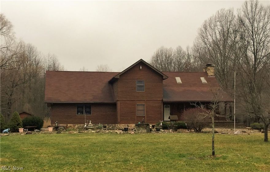 What a find! This unique 3-4 bedroom, 3 bath two-story log home boasts vaulted ceilings, hand cut stone walls, skylights and a terrific great room with stone fireplace.  Additional first-floor highlights include spacious kitchen, dining area, den/office (which could be used as a bedroom) and full bathroom with jetted tub. The second floor offers three bedrooms including the master which has an attached bath with hot tub. The basement has a rec room with fireplace, laundry area and workroom. Other highlights include covered porch, landscape pond, nice storage shed and beautiful acres of land.