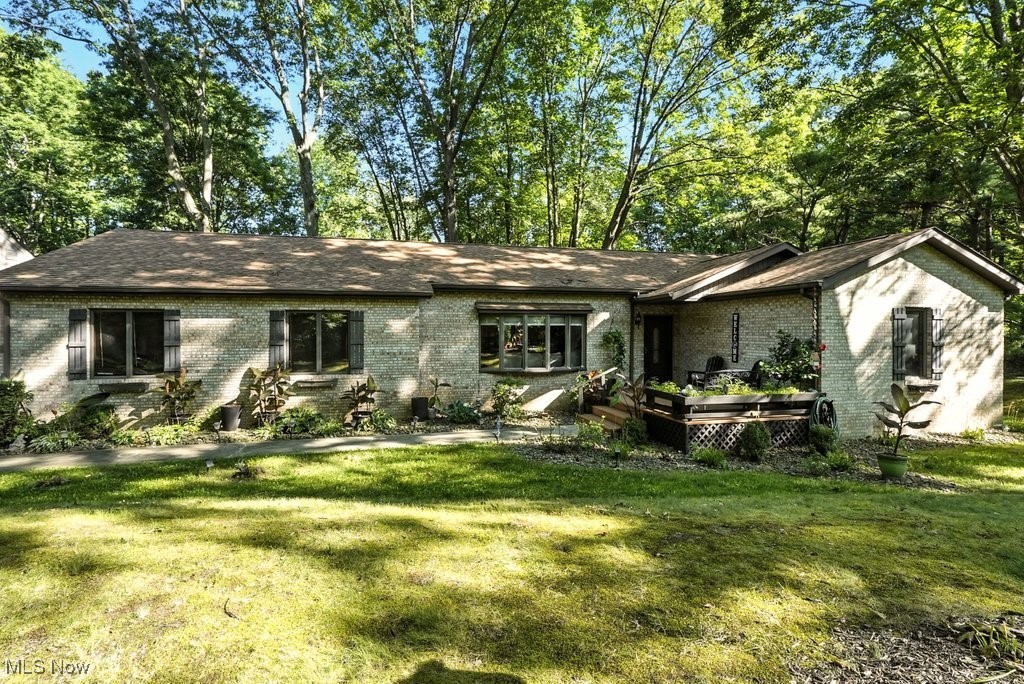 OPEN HOUSE CANCELED! Welcome to this beautifully updated ranch in Kent! Situated on a private corner lot, just minutes from all that Kent has to offer, this spacious and thoughtfully designed property combines comfort, style, and functionality. With over 2800sqft of finished space, 3 bedrooms, plus a 4th in the basement, and 3 full + one half bathrooms, this home offers plenty of room to spread out. Stepping inside from the front porch, you're greeted by a bright, open-concept main level. The layout is great for entertaining with a stunning kitchen with massive island, granite countertops, and abundant cabinetry seamlessly flowing into the dining and living spaces. On those quieter evenings, the gas fireplace provides a perfect spot to relax. The main level has 3 bedrooms, including a large primary with a walk-in closet and en-suite bathroom. Another full and one half bath on this level ensures ample space for guests while the first floor laundry adds extra convenience. Enjoy the fully-enclosed 3-season room year-round with new floors and its own gas fireplace with windows that transform the space from open-air breezes to cozy comfort. The finished & updated lower level provides a ton of extra space and options, with a large recreation room, kitchen w/ bar, 4th bedroom and a full bathroom! Don't worry, there's still plenty of dedicated storage room to keep organized. Outside, you can enjoy the peaceful yard from either the front or back patio. An attached 2 car garage, with a bonus 3rd bay, and a shed are perfect for additional storage and holding all of your landscaping gear or recreational toys! Don't miss your chance to get into this move-in ready home, schedule your showing today!