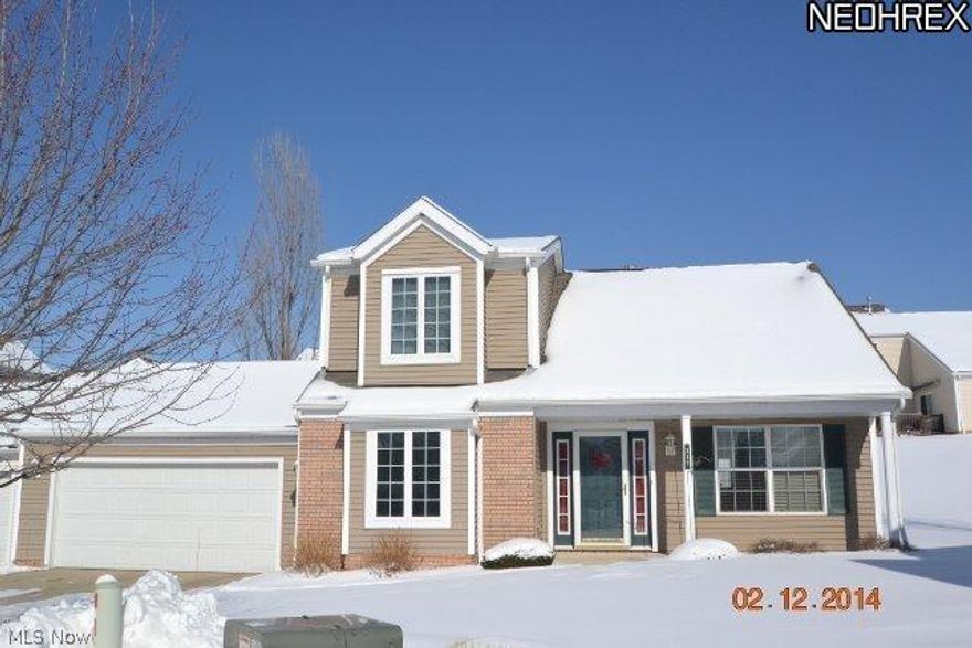 You are going to fall in love with this Springhill Reserve single family home situated on a lovely lot. The home features 3 bdrms and 2 1/2 baths. The 1st floor master bedroom showcases a lovely master suite w/master bath and ceiling fan and large walk-in closet. There is another 1st floor bdrm. The 3rd bdrm is on the 2nd floor and has a full bath adjacent. The kitchen, laundry and all baths feature ceramic tile flooring. The carpeting has been upgraded to Berber and the large great room features a gas fireplace with tile surround. The deck has been extended 6 feet to make it a larger 12x18 deck. The garage is extra wide for more storage space. For those less formal dinners, enjoy your eat-in kitchen and for more formal dinners, enjoy your formal dining room. There are extra outlets in all rooms and the H2O is a 50 gallon tank. Maintenance free exterior vinyl siding w/partial brick front and foundation. Close to I271 and turnpike for easy Akron or Cleveland commute.