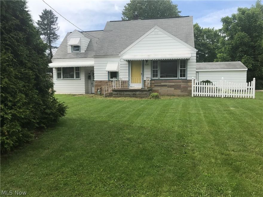 Sitting on two parcels, there is tons of potential in this great Canton South family home.  Covered back patio overlooks private backyard.  Quaint built-ins, spacious rooms, a first floor bedroom and first floor full bath, 2 spacious and charming dormer bedrooms and another full bath on the second floor, some hardwood floors throughout...this house is a diamond waiting to sparkle.  Rec room could easily be refinished in basement.  Being sold as is.