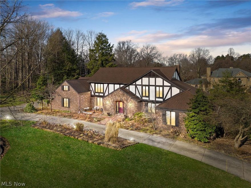 Situated in a very sought after area this enchanting 6-bedroom, 4-bathroom Tudor provides a harmonious blend of seclusion and city convenience. The property's exterior has been meticulously maintained with newly brick walkway, wrap around driveway and four car garage! Outdoor entertaining is a breeze with your own private retreat! Picture a hot summers day, the grill is on, friends and family are over, and you are sitting under your oversized sun setter watching the children splashing and laughing in your inground pool! The home exudes modern charm, showcasing a crystal chandelier when entering, new (LVT) flooring and a soothing palette of neutral paint colors throughout. The sizable kitchen is a culinary haven! An abundance of soft close custom-built white cabinetry, long L-shaped quartz countertop and a massive quartz kitchen island with built in drawers and barstool seating. Also, with breakfast bar and wine rack. All new stainless-steel appliances included! The master bedroom on the first floor is a true retreat, set apart for privacy. With built in shelving, French doors to the pool area and slider barnyard door to the walk-in closet. The attached custom-built master bath has his/her quartz vanity and enormous tiled shower. The great room boasting in size with crown molding, built in shelving and fireplace. Additional living area w/second white brick, farmhouse beam and wood burning fireplace. The 18x14 formal dining room tastefully decorated. First floor laundry with locker room style shelving, granite countertops and half bath complete the first-floor living. Luxurious hard wood winding staircase leads to the second. An astounding five bedrooms and two additional full baths! Featuring recent loft area converted into a 26x15 bedroom w/ jack n jill walk in closets.  Additional three bedrooms with more unique features including walk in closets, storage and built in shelving. The sellers went above and beyond to making this home a masterpiece.