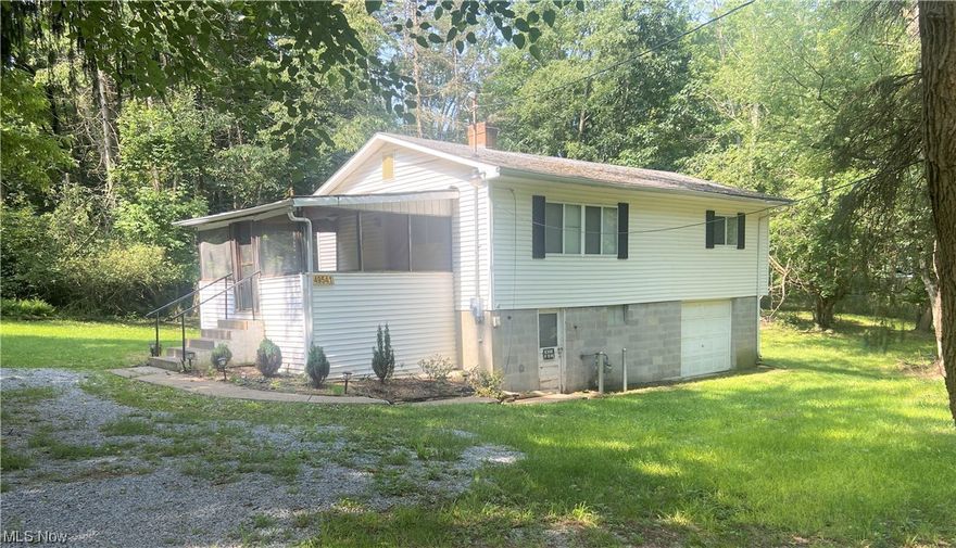 Once you cross the threshold, you will fall in love with this 2 bedroom, 1 bath cottage style home that sits on 2.49 acres! This cozy home offers a 12 x 15 screen porch, spacious living & dining area, eat in kitchen, 2 bedrooms and a bath on the main level. Large picture windows in both the kitchen and living room allow for an abundance of natural sunlight to stream into the home. These windows not only provide a lot of natural sunlight, but they will also provide you with ever changing seasonal views of the treed property. The updated kitchen boasts fresh paint, glass title backsplash, stone counter tops and plenty of cabinetry. For your convenience there is a laundry chute in the bathroom linen closest. The basement is where you will find the laundry area, utilities, additional storage space and the garage. This property has rear acreage that will give the new owner the opportunity to entertain friends and family, while also enjoying complete privacy. A new septic system was installe