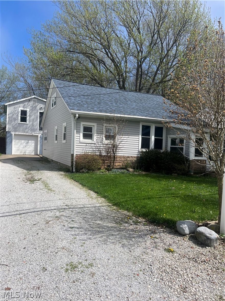 Updated 3-bedroom, 1-bath home in desirable Painesville Township Park, just a short walk to Lake Erie! Nestled on a quiet street, this charming home features new vinyl plank flooring, fresh paint, and updated fixtures throughout the main level. A welcoming enclosed front porch opens into a spacious living room, with two generously sized bedrooms conveniently located off the main hallway.
The updated kitchen offers new countertops, flooring, paint, and a dishwasher, with easy access to the full bath and laundry area—complete with a new vanity and included washer and dryer.
Upstairs, a large versatile space provides endless possibilities—use it as a primary bedroom, additional living area, or convert it into multiple rooms.
Major mechanical updates include a new roof, furnace, and hot water tank (2024 or newer), offering peace of mind. The detached garage includes a one-car bay plus an upper level ready for a workshop, studio, or extra storage, with electricity, water, and heat already in place.
Don’t miss this opportunity to enjoy comfort, flexibility, and proximity to the lake!