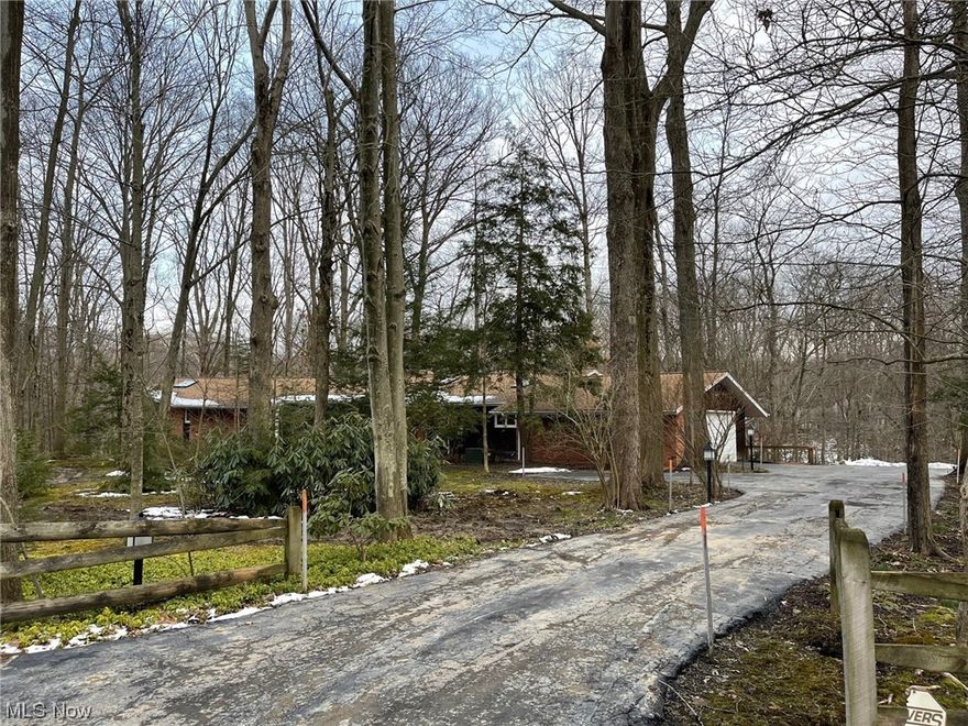 Once in a lifetime opportunity to own a unique home on a spectacular lot overlooking Wiley Creek. 2 acres of parklike magnificence, on Deep Creek Lane in Moreland Hills (Orange Schools). This contemporary style home is well-maintained, ready for updates, over 3500 sq ft including a walkout basement. Potential 1st-floor living with a massive owner's suite (2 bedrooms were combined to create this space) which includes a walk-in closet, French doors to the private back yard, en-suite bath with jetted tub, separate shower, huge vanity with double sinks. The Great Room has vaulted ceilings, fireplace (1 of 3!), wood floors, & sliders to an incredible enclosed porch with amazing views! The kitchen includes all appliances, and even has its own fireplace. Other features: 2 laundry rooms (1st floor AND lower level), separate entrances that would be conducive for an in-law/teen suite or work from home, entry foyer & formal dining room with Murano glass chandelier, 3.5 baths, upgraded electrical,