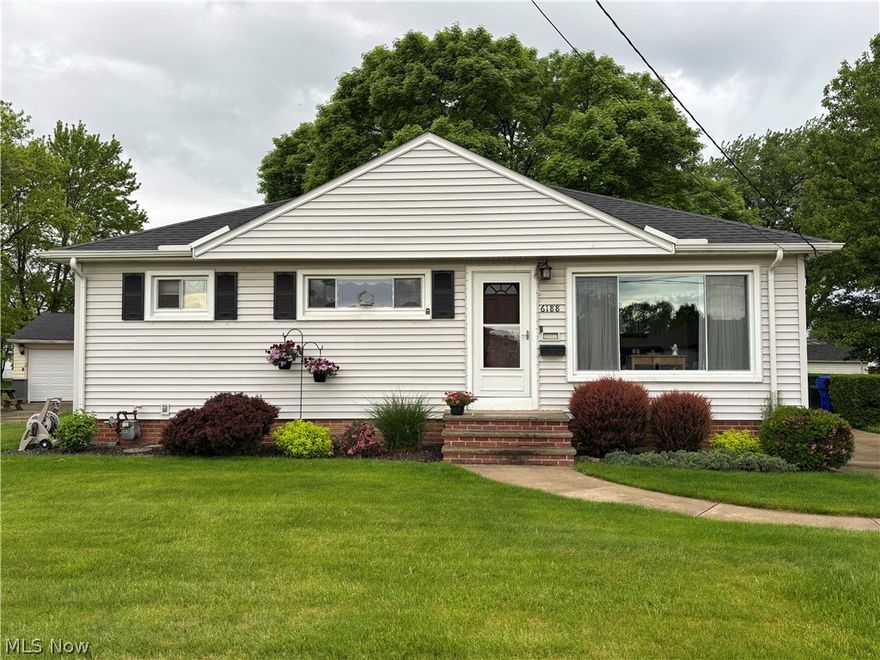 Welcome to this immaculate and exceptionally well-maintained 3 bedroom (potential 4th bedroom/ bonus room), 2 full bath home featuring a spacious layout, extra-large semi-fenced yard, 2.5 car detached garage, and an incredible covered back porch perfect for outdoor living. This move-in ready home also includes kitchen appliances (refrigerator, microwave, range, and dishwasher) and offers added peace of mind with a seller-provided APHW home warranty. Featuring one full bathroom on the main floor and an additional full bath in the basement, this home provides functionality for everyday living.

The home showcases neutral décor that creates a warm and inviting atmosphere, making it easy to personalize and truly feel at home. The bright and spacious living room is highlighted by a large window that fills the space with beautiful natural light.

Step outside and enjoy the beautifully landscaped yard filled with an array of vibrant flowers in every color. In the warmer months, their sweet aroma fills the air, creating a peaceful and relaxing setting that is just as lovely to experience as it is to admire.

One of the standout features of this property is the amazing covered back porch, constructed of 100% recycled polyethylene, meaning it never needs painting or restoration. It is perfect for morning coffee, evening relaxation, or simply taking in the view of the gorgeous landscaping hassle-free! A picnic table is included and will remain with the home, making outdoor gatherings even easier.

Inside and out, this home offers practical features buyers will appreciate, including abundant storage throughout, a recreational room, and a dedicated workout area in the basement. The home is well insulated, helping to keep utility costs economical year round. Major mechanical updates include a hot water tank replaced in 2024.
This cared for property offers both charm and functionality in a setting that feels welcoming. Call your realtor today to view this home!