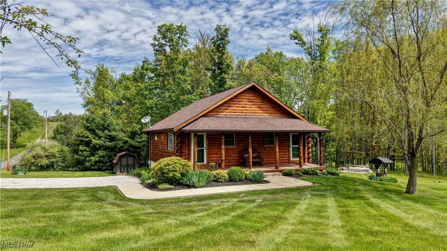 Located just minutes from Sugarcreek, this unique cabin offers two identical sides—one currently used as a long-term rental and the other set up as an airbnb. Each side features one bedroom with a small closet, a full bath with a walk-in shower and jacuzzi tub, and a fully equipped hickory kitchen. There is a shared laundry area available from both sides of the duplex. The property is tucked off the main road but offers quick and easy access for shopping, dining and more. Mechanics include two water heaters, a private well and septic system, full water filtration system, a furnace and central air. The full basement provides convenient storage, as well as a storage barn which offers added convenience for outdoor or seasonal items. Whether you're looking for an investment opportunity or your own country getaway with income potential, this turnkey property is ready to go.