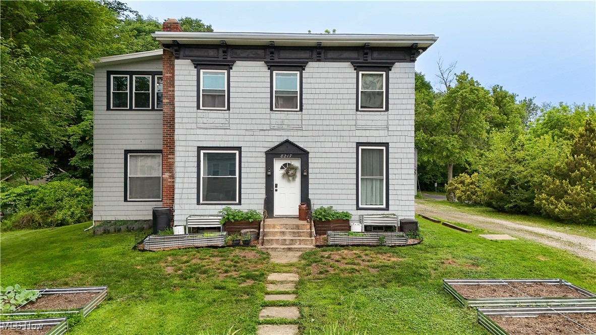 Seller-paid home warranty offered for offers accepted by 7/15! Can’t decide between a quaint village home or a small homestead with a huge garage? This property has it all! Welcome to a beautifully updated home offering 2,500+ sq ft of character-filled living on a picturesque 0.34-acre lot. Located across from the village park and next to the YMCA, you're just a short walk to downtown shops, restaurants, entertainment, and the PARTA bus line. Inside, enjoy an open, functional layout perfect for daily living and entertaining. The oversized living room features a fireplace with a wood-burning stove insert, and the dining room includes an antique built-in China cabinet. The kitchen was fully remodeled in 2022 with new cabinets, counters, appliances, and an exposed chimney. The main level also includes a spacious master suite with walk-in closet and private bath, a home office or gym, mudroom, and hickory flooring. An EcoBee thermostat adds energy efficiency. Upstairs offers four bedrooms, a fully renovated bath, sunroom (great for a second office), and a large bonus room. The entire second floor was rebuilt in 2022 with new electrical, HVAC, drywall, and flooring. The detached two-story, six-car garage includes a full loft and newly insulated lower level (2024). Outdoors, enjoy a backyard oasis with a deck, fire pit, fruit trees (apple, peach, pear), berries, nut trees, and ten raised beds. Bonus: deluxe chicken run for 12 hens. Major updates: house roof (2022), garage roof (2017), HVAC (2017 down & 2022 up), water heater/washer/dryer (2024), windows/doors (2022), kitchen/foundation upgrades, and certified lead abatement (2022). This home offers charm, space, and modern updates—don’t miss your chance to make it yours! Seller is a licensed agent in the state of Ohio.