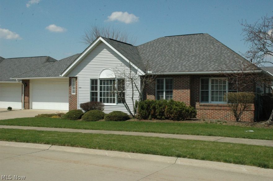 Desireable custom condominium in 55+ Community.  Exceptionally appointed with many updates and upgrades in 2008.  Luxury kitchen accented with granite countertops, hickory wood floors, built in China Closet, stainless appliances, 95% efficient furnace & central AC.  Great room with full wall built in bookshelves.  Unique family room overlooking the community pond features heated porcelain tile floor.  The private vinyl deck overlooks the pond that features a fountain in the summer months and a walking path.  Custom blinds/curtains remain.  Wide doors, fully accessible baths, freshly painted spacious rooms.  Lots of storage too!