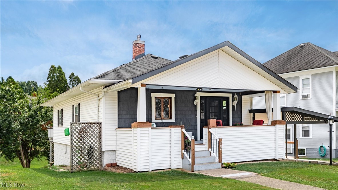 This beautifully renovated two-bedroom bungalow offers the perfect blend of modern updates and cozy charm—making it a smart choice for savvy investors or first-time homebuyers. Completely move-in ready with the entry defined by weathered charm of richly painted antique oak fluted casing and all rooms refinished adding modern updates. The farmhouse ceiling fans complement each room. You will love the refinished walnut flooring and new door thresholds throughout, and a bright, open layout designed for comfortable living. The updated kitchen adorned with built in whirlpool appliances. Modern clean and sleek mudroom with built in shelving for storage. CedarTone decking was used to renovate the side porch and added safety enhanced side deck from the carport to kitchen. Additional outdoor living with ready to use gas grill hooked into the home gas line on the spacious deck overlooking the shaded back yard. The front porch offers ample space for family and neighbors to comfortably gather and engage in conversation. Furnishings are negotiable, offering flexibility whether you're looking to settle in or furnish it as a rental. Conveniently located close to town amenities, the local hospitals and medical offices, and with quick access to the interstate, this home is perfectly positioned for both convenience and lifestyle. Don’t miss this turnkey opportunity—schedule your showing today!