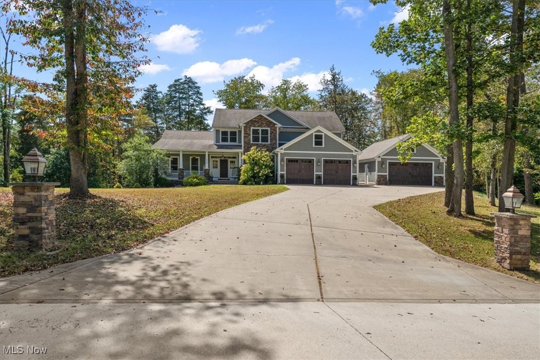 Timeless elegance meets CUSTOM built modern Craftsman style ........... FIVE ACRES of woods and privacy. This Frank Betz designed ten year old residence features 4200 square feet of above grade quality. Inviting front porch, Great room with stone stacked gas fireplace, eat in kitchen, appliance package, dining room, OWNERS ENSUITE that opens to patio and three or four additional guestrooms. Attached two car garage, detached over sized two car garage, screened porch, level grounds, easy care exterior and ONE FLOOR LIVING. OPEN HOUSE SUNDAY September 7th from 1:00 until 3:00.