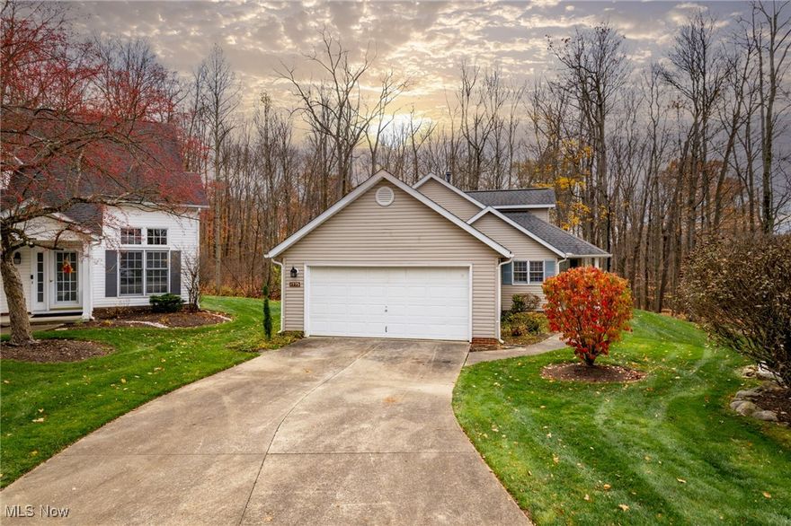 Welcome home to this charming, freestanding cluster home located on a quiet cul-de-sac in beautiful MacIntosh Farms! This lovely, three bedroom, two full bath home has been tastefully updated throughout.  Walk up to the inviting front porch and into the bright, spacious living room with vaulted ceilings and tons of natural light.  The beautiful brand new kitchen boasts lots of cabinet and counter space including an island with extra storage and seating, brand new stainless steel appliances, pantry, and a breakfast nook overlooking the private outdoor deck.  The entire second floor houses a gorgeous, private master suite with large bedroom area, walk-in closet, and an impressive brand new master bathroom with double vanity, walk-in tiled shower with glass doors, and soaking tub! The lower level has two additional bedrooms and completely remodeled full guest bath. This home has brand new carpet and flooring throughout, two car attached garage, and convenient main floor laundry.  Enjoy the amenities that MacIntosh Farms has to offer, including pool and tennis courts! You will not want to miss this very beautiful home.