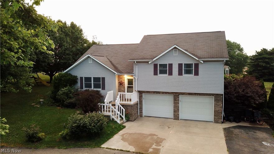 Beautiful split level home located on a cul de sac in a quiet neighborhood in West Muskingum Schools. The yard is almost an acre mowed and landscaped perfect for entertaining and gardening.  Home features 3 nicely sized bedrooms and 2 full baths, with several upgrades throughout. The kitchen and dining area have been updated to feature new tile flooring, refinished cabinets and some new appliances. New carpeting has been installed in the living room and the two entry way staircases. The large two car garage leads into a half basement with ample storage space perfect for an at home office or a playroom. As an added bonus the heating system is a geothermal water furnace.