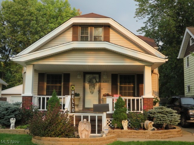 Paradise in Cleveland!! Step to a relaxing front porch, thru a beautiful front door into central air and into a awesome open concept 1st floor with a dinning room and a chandelier, leaded glass china cabinets, 1st floor bedroom, a glamour bath, a bonus room and ceiling fans. A fantastic custom built kitchen with all appliances and plenty of cabinets! Two large bedrooms and a sitting area on the 2nd floor. The lower level has an awesome full bath, nature stone flooring and a finished rec room with a washer and dryer. Outside boasts a fenced park like yard with an outside kitchen with a skylight! A 16x10 pool house with a skylight, a 27 ft round pool, a tool shed, a bar area, plenty of lighting for the night parties with remotes! Even has a hook up for a hot tub! A new roof, newer windows, and glass block windows. A supreme home warranty included! Close to Cleveland Metro Park Zoo, and freeways minutes away. Make this paradise your home sweet home!!