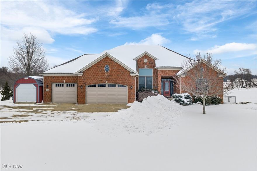 Welcome to this stunning brick ranch, offered as part of an exceptional horse farm estate—available to be purchased separately with 2.4 acres or together with the equestrian facilities as referenced in MLS #5173790. This beautifully updated home offers spacious, turnkey living with sweeping views of rolling fields and picturesque pastures. Completely renovated from top to bottom, the interior blends quality craftsmanship with a warm Southwestern flair. The chef’s kitchen is a true showpiece featuring Thermador refrigerators, a gourmet gas range, a hidden butler’s pantry, and an oversized center island with breakfast bar—perfect for entertaining or everyday living. The dramatic great room is anchored by a massive custom stone gas fireplace set beneath soaring vaulted ceilings, with French doors leading to an expansive deck overlooking pasture land. The views alone make this home unforgettable. Designed with lifestyle in mind, the home includes a custom dog wash room connected through the heated garage to an exterior run, allowing pets to move safely in and out with ease (when unlocked). For buyers without furry family members, this space can easily be converted back to a traditional laundry room. The primary laundry area is currently located within the luxurious owner’s bath—paired with a generous closet room for the ultimate convenience of wardrobe and laundry in one place. The full finished walk-out lower level expands the living space with a large recreation area, complete with a full bar—ideal for hosting. Two additional bedrooms are located on this level, each with access to their own full bath, including one ensuite setup perfect for guests or multigenerational living. From mechanicals to finishes, updates throughout the home are extensive and thoughtfully executed. Whether purchased independently or in combination with the adjoining horse facilities, this property offers a rare opportunity to enjoy refined country living with unmatched views and flexibility.