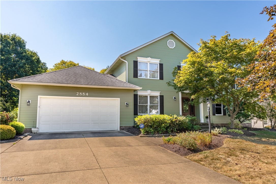 Welcome to this stunning colonial in the desirable St. Ives neighborhood, where timeless elegance meets modern updates. A spacious foyer greets you upon entry, leading to the formal dining room and a first-floor office with French doors—ideal for work or study. The heart of the home is the newly remodeled eat-in kitchen, featuring a copper sink, granite countertops, a handcrafted hood over the stove, and plenty of storage. The kitchen flows seamlessly into the great room, where a cozy gas fireplace and built-in shelving create a warm, inviting atmosphere. A first-floor laundry and half bath add convenience to the layout. The finished basement offers endless possibilities with its open-concept design, complete with a workout area and generous storage space. Upstairs, you’ll find four spacious bedrooms and two full bathrooms, including a serene master suite with a double vanity, makeup area, a skylight, and a large walk-in closet. Step outside to enjoy the enclosed three-season room with cathedral ceilings—perfect for morning coffee or evening relaxation. From there, access the expansive stone patio featuring a built-in firepit and multiple spaces for entertaining family and friends. Meticulously maintained and move-in ready, this home is in pristine condition and ready to welcome its next owners.
