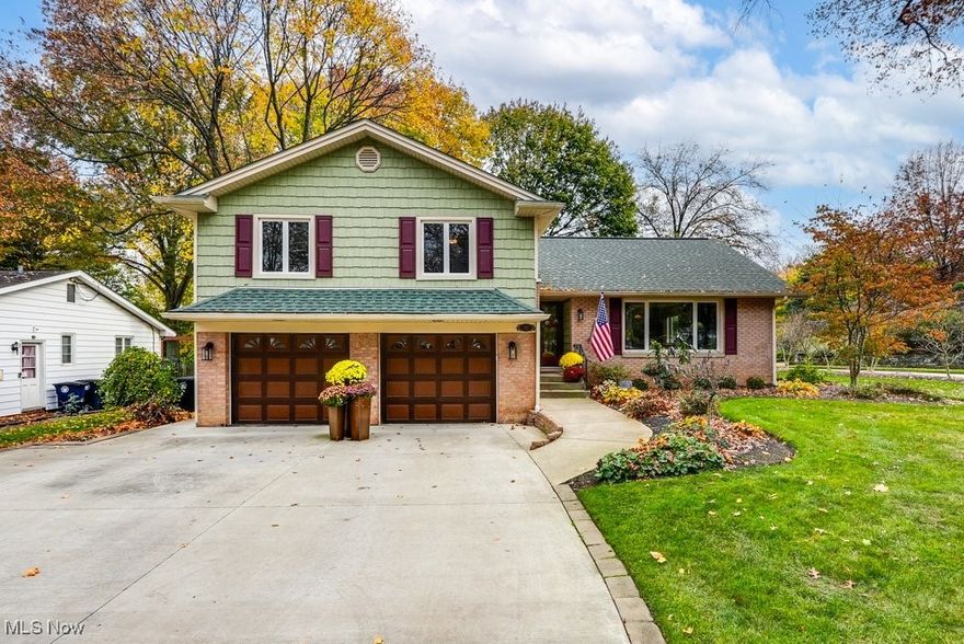 This gorgeous and fully renovated beauty has been owned by the same family for 62 years. This stunning 3-bedroom, 2 full and one-half bath home is nestled in the highly sought-after Merriman Heights neighborhood and has won the Akron Beautification Award many times, including in 2024! With its spacious floor plan, modern finishes, and backyard oasis, it is perfect for both entertaining and family living. Check out the gourmet kitchen with custom cabinetry, upgraded stone countertops and custom lighting handmade at Akron Glass Works. The dining room/living room with original hardwood floors, half bathroom and cozy family room with fireplace and original built-ins complete the first floor. Upstairs the primary suite features a walk-in closet and an en-suite bathroom with a double vanity and walk-in shower. Two additional bedrooms share a full bathroom, providing plenty of space for children, guests, or a home office. On the ground floor level there is a recreation room with built-in cabinets. The basement has additional space which is currently being used as a home gym and a large laundry and ample storage. Outside there is a deck and large patio space for all of your outdoor living. Everything has been done here and is ready for the next owner(s) to fall in love with it.