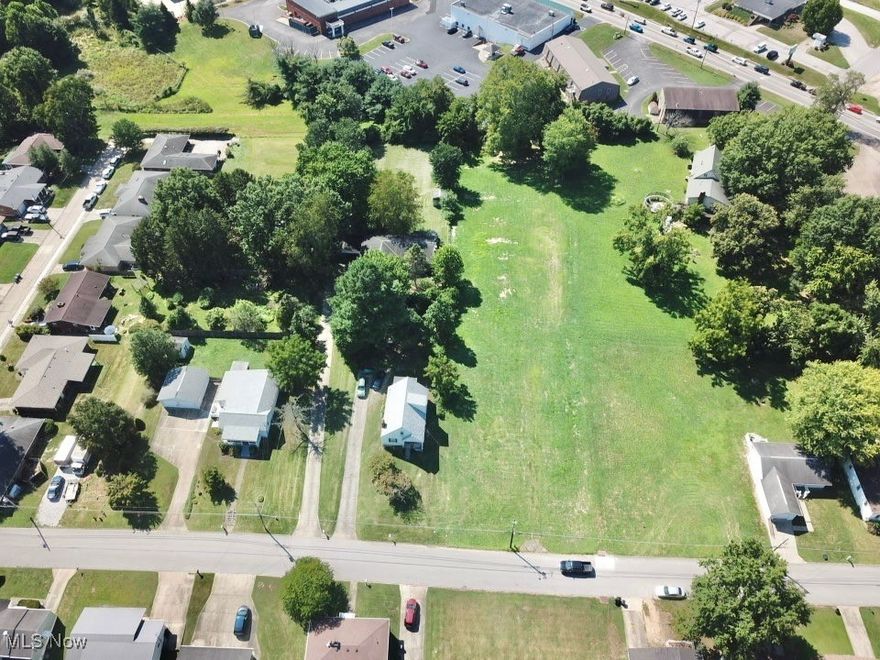 Rare Opportunity Within City Limits! Nearly 1 Acre Cleared Lot! Discover the potential of this spacious, cleared lot—just under one acre and conveniently located within city limits. Whether you're looking to build your dream home with room to spare or develop multiple properties, this parcel offers exceptional flexibility and value. This oversized lot can remain a generous single homesite, be split in half, or be subdivided into four approved building lots. A preliminary survey for a 4-home development has already been pre-approved by the city (with conditions) and is available upon request. All utilities are available at the road, making this an ideal choice for builders, investors, or anyone seeking both space and convenience.