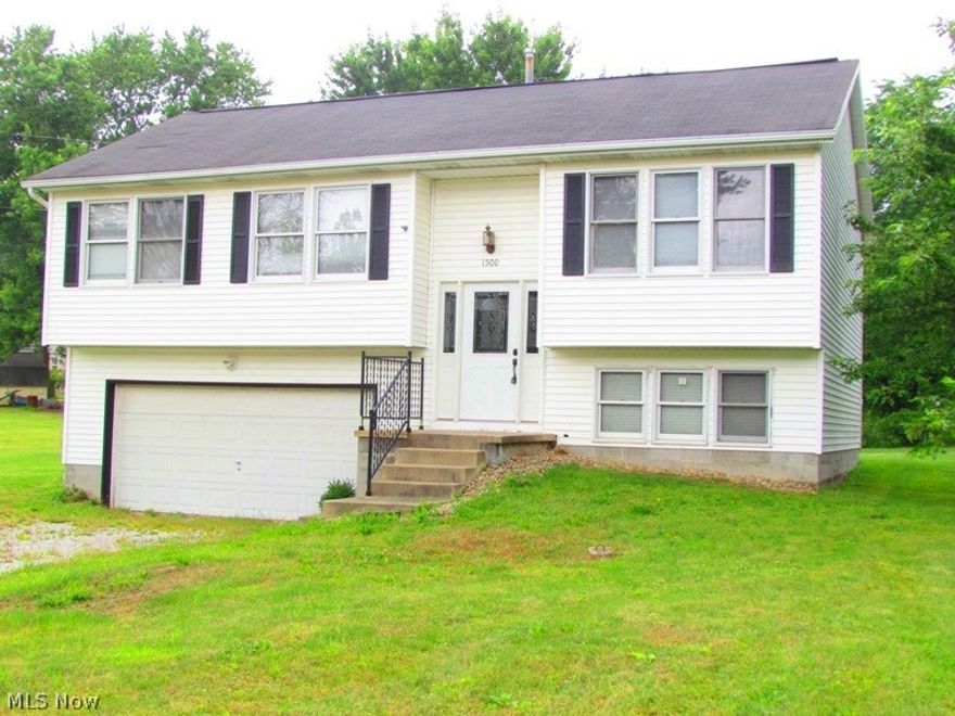 You will love this location with only minutes to I-77 and in a desirable Copley township. This attractive split level home has one of the best islands, ideal for entertaining guests. What a great open floor plan, with new custom designed raised panel kitchen, angled island with plenty of drawers and storage space, as well as wonderful white smooth edge cabinets. Elegant counter tops compliment this elegant kitchen with double drawers, new under the cabinet lighting, nice fridge and new hardware. Flooring features medium oak finish, and this laminate is easy to maintain on the 1st level. Full bathroom features new ceramic tile shower tub, new vanity, mirror and lighting. 3 bedrooms are nice size and great closet space. Lower level features spacious Rec room with track lighting and wall of windows. Easy access to laundry and 2 car attached garage. Owner built a new deck overlooking a spacious backyard as well as plenty of space on the side yard. Great home to relax in, great location, si