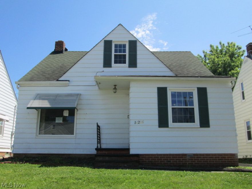 Traditional style bungalow on tree lined street.  Vinyl replacement windows and glass block windows.  Two car detached garage.  Open kitchen, partially finished basement and much more.  Fantastic opportunity.