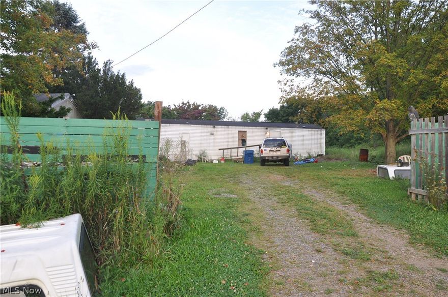 Large mobile home on almost 4.5 acres within a few minute drive to Lisbon. The home offers 3 bedrooms and 1 bath. In addition there is an additional manufactured home with other rooms that is directly attached to the home that could be additional bedrooms or storage if desired. In addition there is a two car garage. Plenty of room for building your new home.