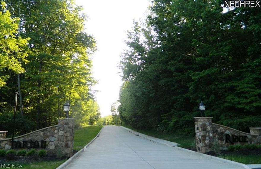 Beautiful wooded building lots located in Wooster's only gated community.  This uniquely private neighborhood, conveniently located close to schools & shopping, offers abundant green space, city services in this well planned development. Bring your own plans or design your dream home.