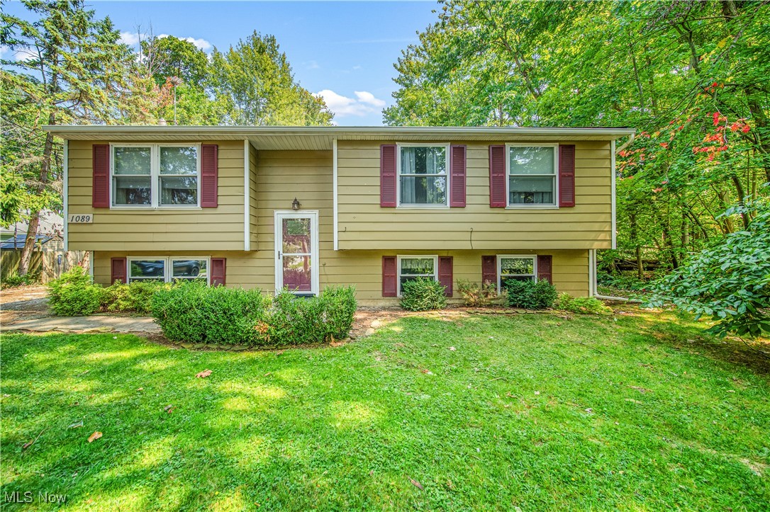 Welcome to 1089 Edgewood! This split level has been so well loved and maintained and is ready for the next owner! You are welcomed by the large living room that is overlooked by the generous sized living room and dining area. The upper level features three large bedrooms and a large full bath. The lower level has a secondary living room and a full primary suite! This lower level bedroom is large with ample amounts of closet space and a connected full bath with heated floors! There is an unfinished room in the basement which you can make in to the room of your dreams! This room would make the perfect in home office, gym, playroom..anything you can dream of! The backyard is large and private with a beautiful deck. The oversized garage is perfect for storage or any car jobs you can think of! This is the one for YOU! See it today before it is gone.