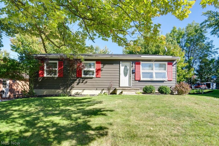 Did you say 3 bedroom RANCH in North Hill? Welcome to 1239 Big Falls Ave. Akron, OH. This home is move-in ready and available now! You'll appreciate the Private, Fenced-in, and flat back yard with a patio. Plenty of room to entertain outside, build a play set, plant a garden, or design an outdoor lounge! Enjoy the updated eat-in kitchen with newer cabinets. Appliances (Dishwasher, Stove, Microwave, Fridge) all stay and are a part of the one year APHW Home Warranty (included with the sale). There are 2 FULL Bathrooms, plus a partially finished basement! The basement could easily be finished to offer additional living space. Updates include Bathrooms, Kitchen, and Roof. Separate Laundry Room in the Basement - Washer and Dryer stay.