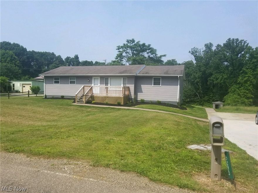 Nicely remodeled home with terrific curb appeal just minutes from Cambridge and New Concord, and in John Glenn school district. This ranch style home has 3 bedrooms and 3 full baths, a large eat-in kitchen, and a finished family room in the basement with new carpeting, so there's plenty of room for everyone! The master bath has double sinks, a large soaking tub, plus a separate shower stall. The laundry is on the first floor off of the master bedroom. The kitchen has updated cabinets and a large island, plus ceramic floor tiles.  The living room and Master bedroom have hard wood floors.  It also has a sliding glass door onto the back deck. The exterior has a brand new front porch, sidewalk, landscaping, and cemented driveway. All of this on a nice lot in a rural setting, complete with wildlife. Don't miss out on this one!