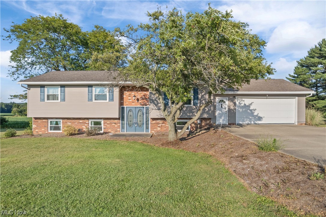 This raised ranch is a spacious and solidly built home with over 2600 square feet of finished living space, there is plenty of room for everyone! The home features 4 bedrooms, plus an office, which provides ample space for work and study. In addition to that, it also boasts two kitchens, which is a rare find in most homes and is perfect for entertaining guests or accommodating large and/or extended families/friends. The property also has 3 full bathrooms. The walkout lower-level features a covered patio and built-in grill pit, making it an ideal spot for outdoor entertainment with a peaceful view of farm fields behind the property. There is also an over-sized 2-car garage and a storage shed to store all your tools and equipment. This property is located in the Southeast Local School District within 10 minutes of Wooster and SR 30. The newer windows, shingles, furnace, AC unit, and hot water heater are excellent updates, and while it may need some cosmetic TLC, it has the potential to b